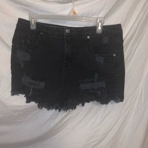 black ripped shorts